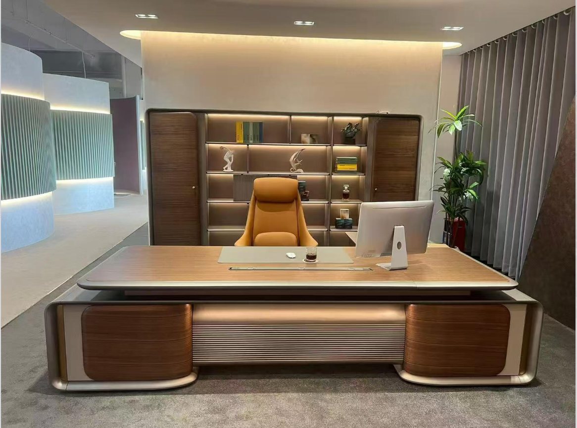 Executive desk set with leather task chair on display in a Foshan furniture showroom