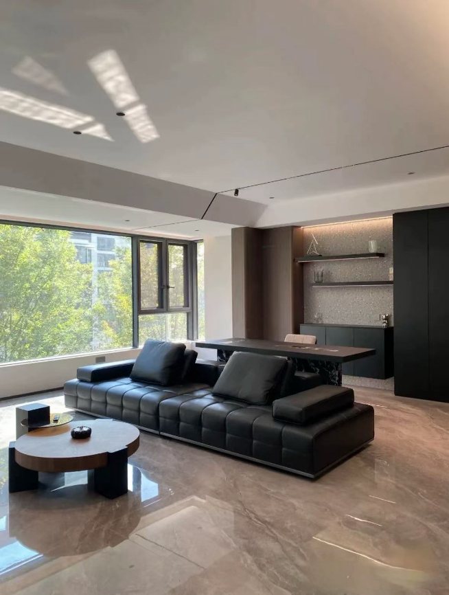 Leather sofa with marble coffee table in a completed client living space